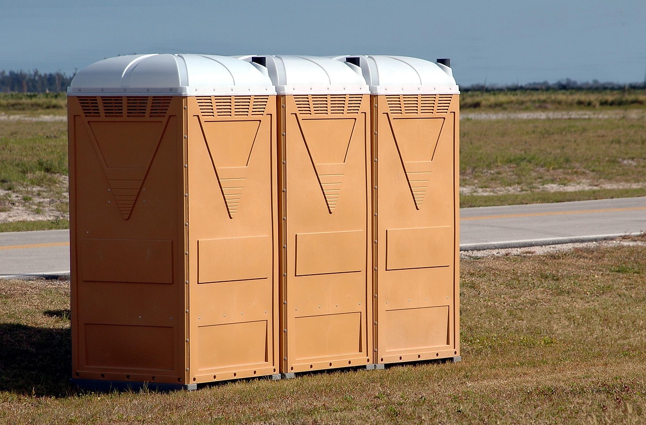 Three portable toilets.