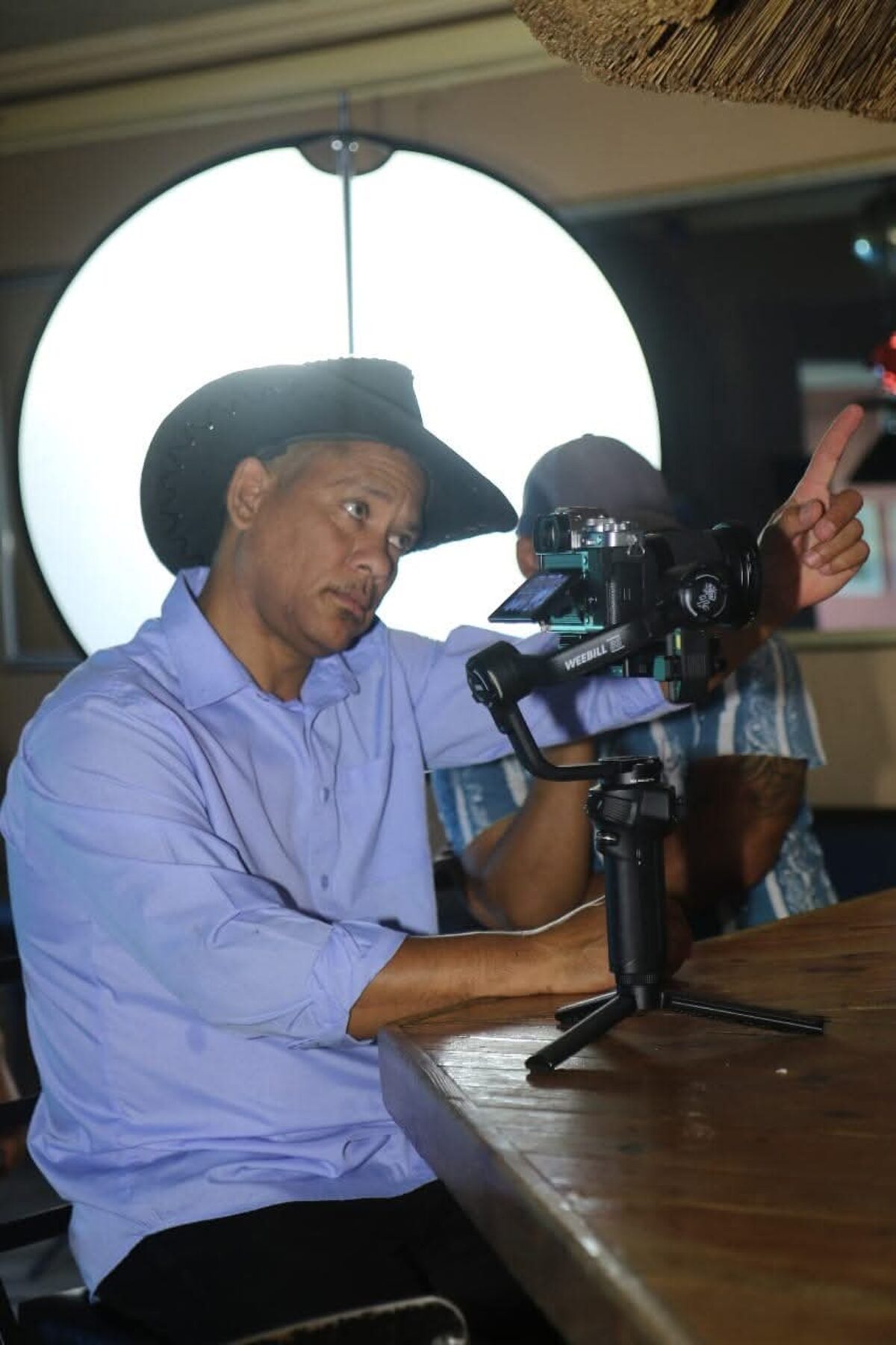 Denzil Booysen with a video camera.