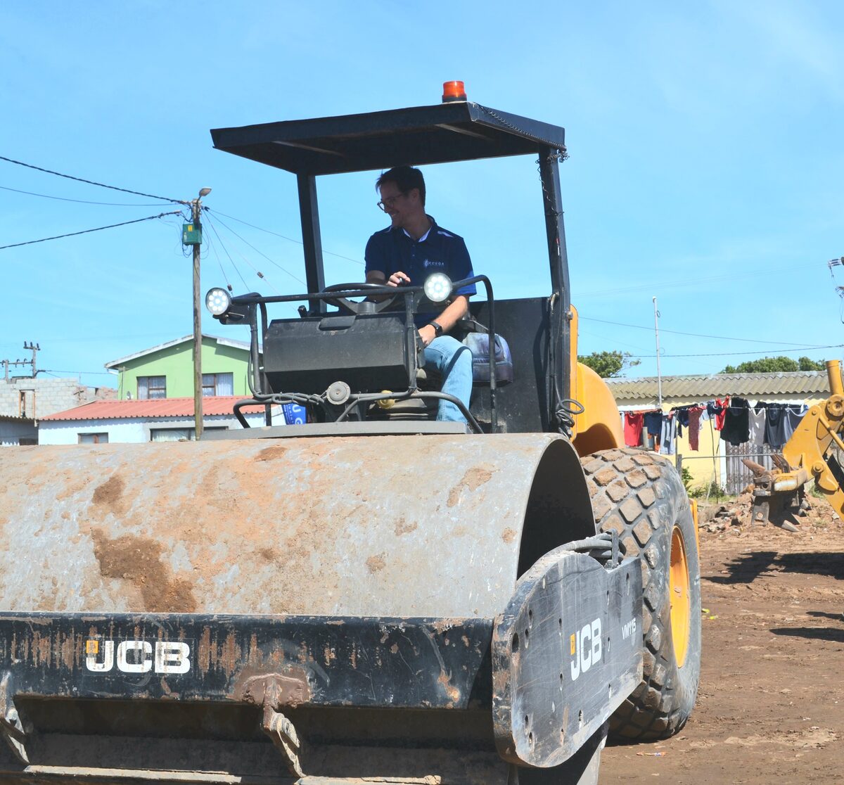 Executive Mayor Hattingh Bornman on a road roller.
