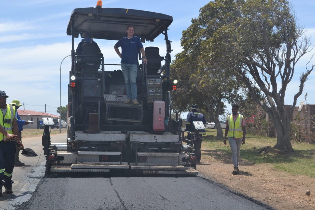 Executive Mayor Hattingh Bornman on a construction vehicle.