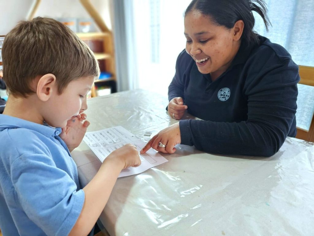 Sharoneale Miles (Special Needs Educator) with one of the learners at the school.