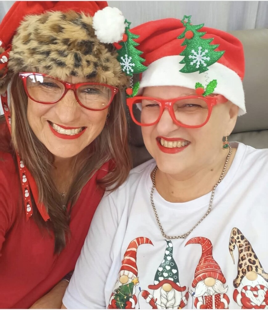 Soria Swart and Veronica Fourie wearing Christmas attire.