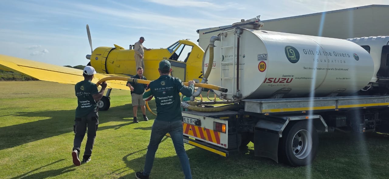 Gift of the Givers are onsite at St Francis Bay airfield to fill a 2000 litres water bomber helicopter from Mossel Bay.