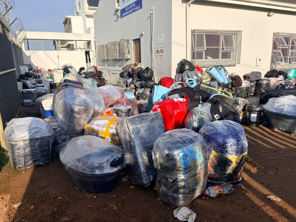 Volunteer group assisting Malawian nationals at Sea Vista Hall ahead of their repatriation to Malawi.