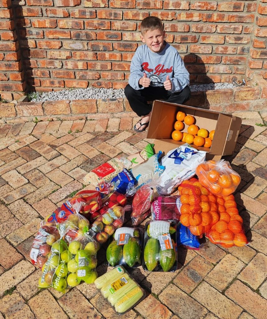 Grade 5 learner Caleb Vlok with donations collected for African Dawn Bird and Wildlife Sanctuary.