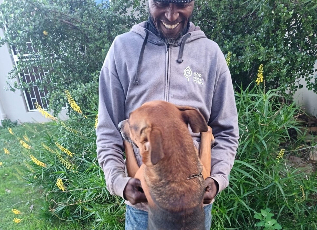Fireman the dog with owner Stephen Singhini before their planned reunion in Malawi.