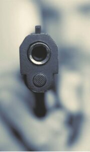 Woman shot and killed in front of her children