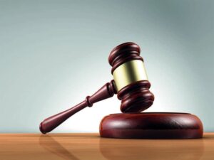 Four men in court for stoning police officer to death