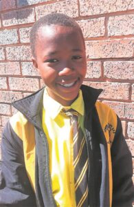 Teacher supports learners in publishing a poetry book