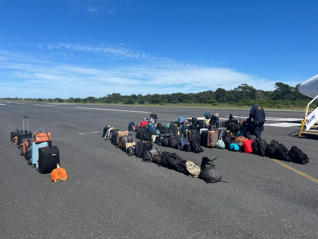 Emergency and security teams at King Phalo Airport after a bomb threat on a commercial aircraft was investigated and declared a false alarm.
