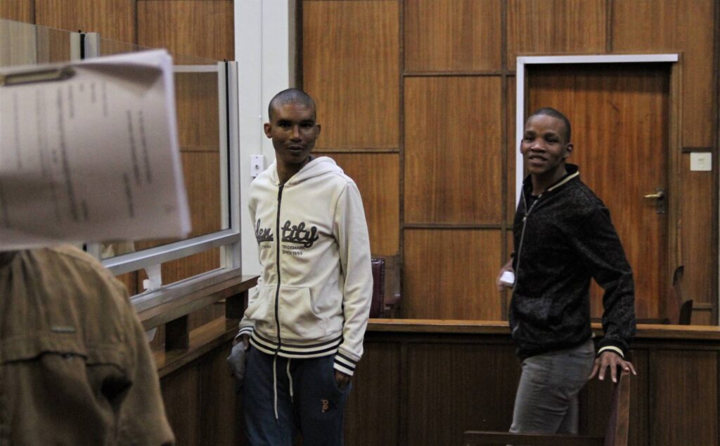 Die drie beskuldigdes vroeër in die hof. 