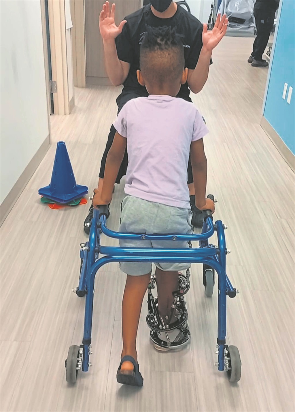 Phetogo receiving physical therapy at the hospital