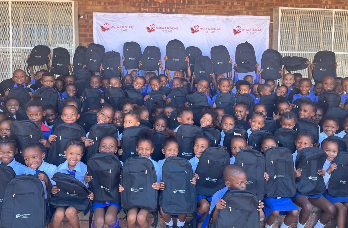 Learners with their new schoolbags.