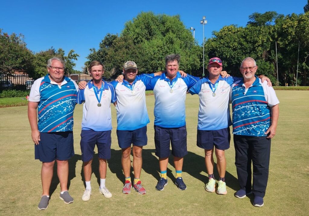 The men's fours champions with the president and vice-president of Northern Cape Bowls. 