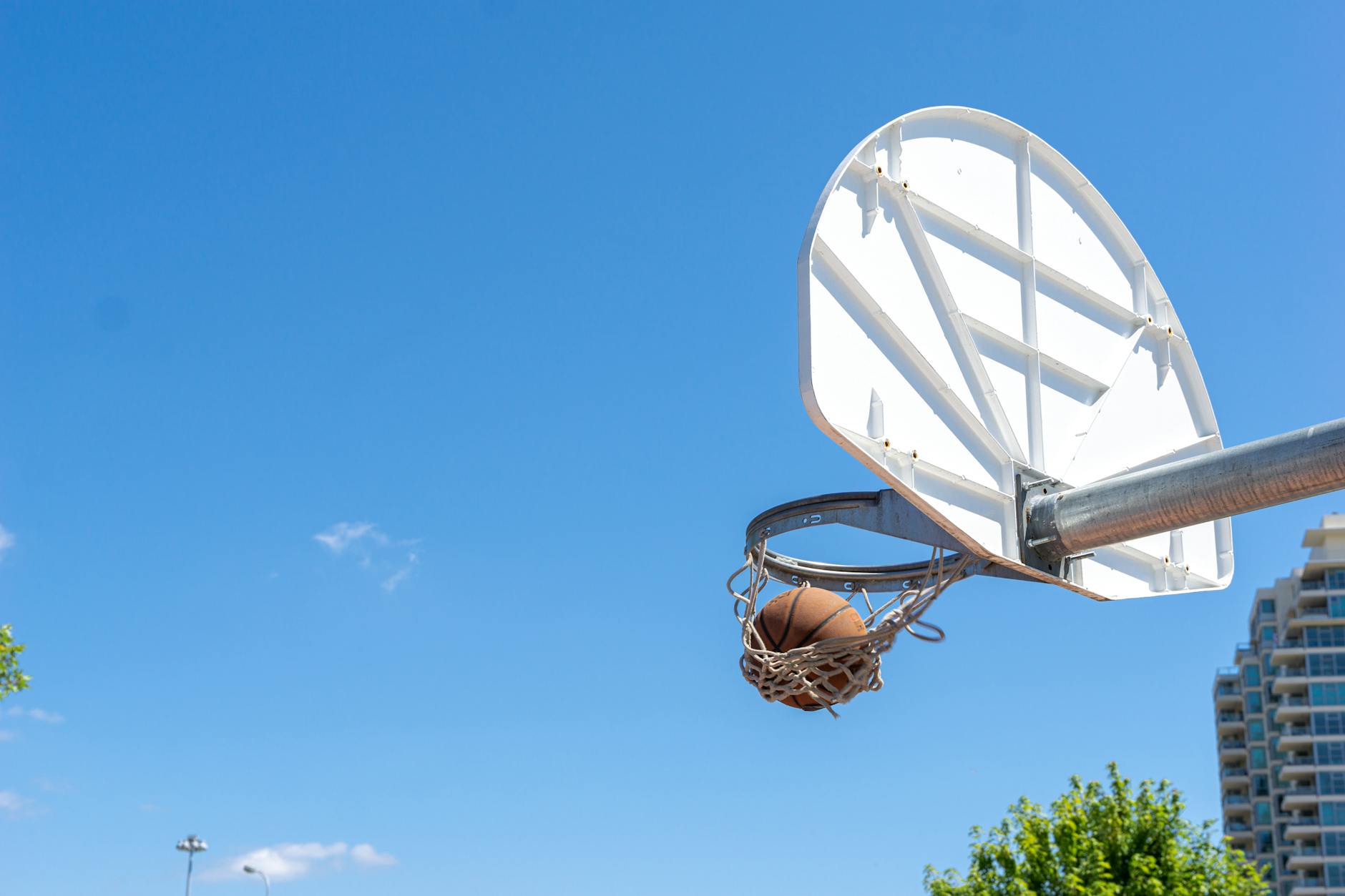 a ball inside a basketball ring