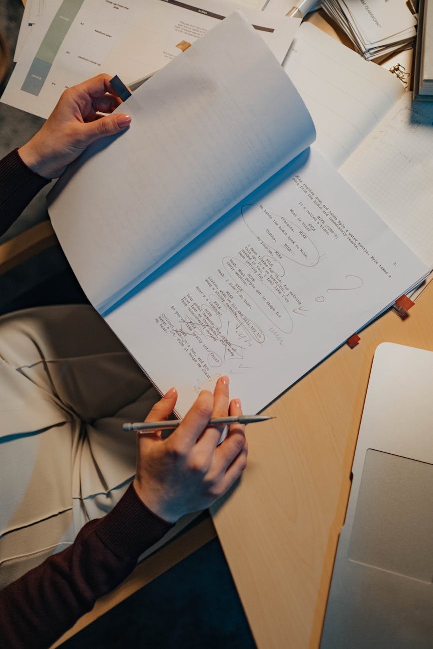 close up of woman sitting at the desk and studying