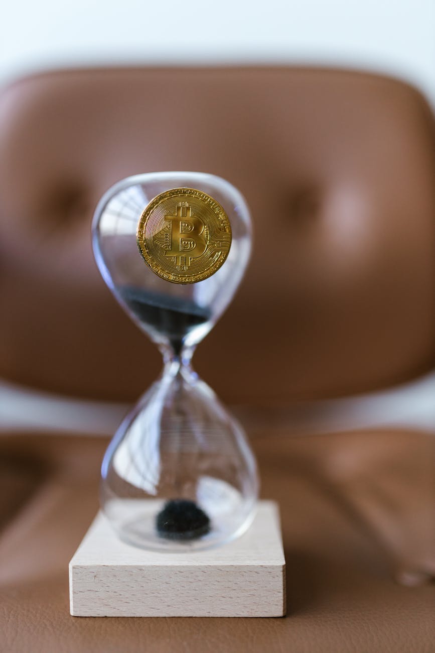 gold coin on a hourglass