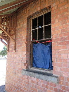 Broken windows, broken heritage: Memorial office vandalised while buck is passed