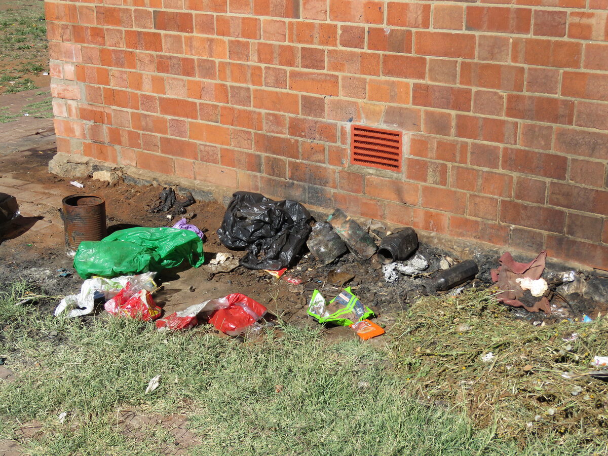 Some of the burnt rubbish next to the custodian's office.