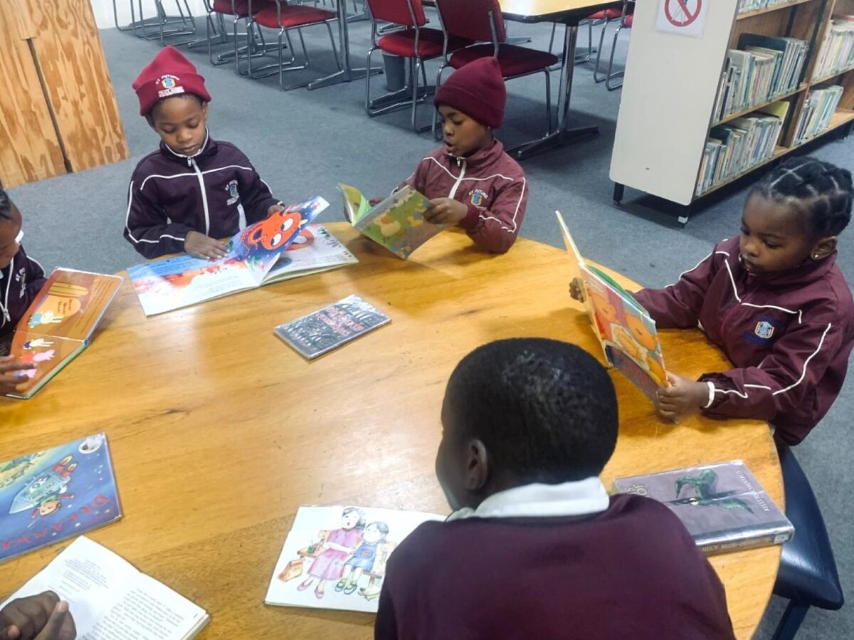 Grade 1 learners are from the left, sitting around the table, Lebone Nyambe, Lulu Mtheto and Alvin Muponda.