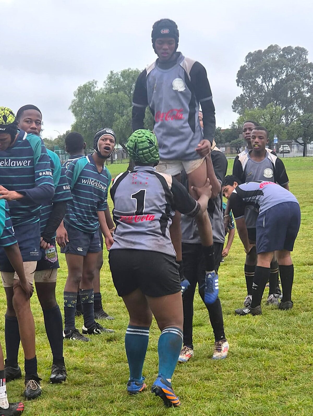 Siphokazi van der Merwe (green headguard), loose-head prop for the Homevale High School