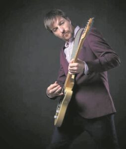 Albert Frost strums the blues at Old Mill