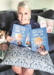 Juffrou skryf boek om kleuters met skool te help