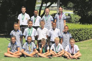 Hugenote ryg die medaljes by Skadu-atletiekbyeenkoms in