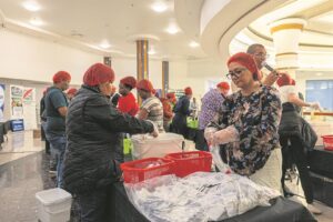 The Bridge hosts meal packaging event in honour of Mandela Day