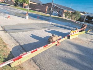 Man digs into own pocket to fill potholes, trench in Algoa Park