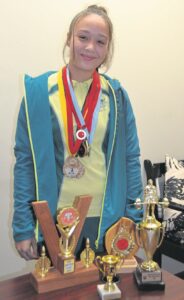 Local teen shows her mettle in weightlifting