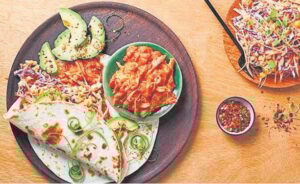 Chakalaka chicken tortillas with fresh slaw