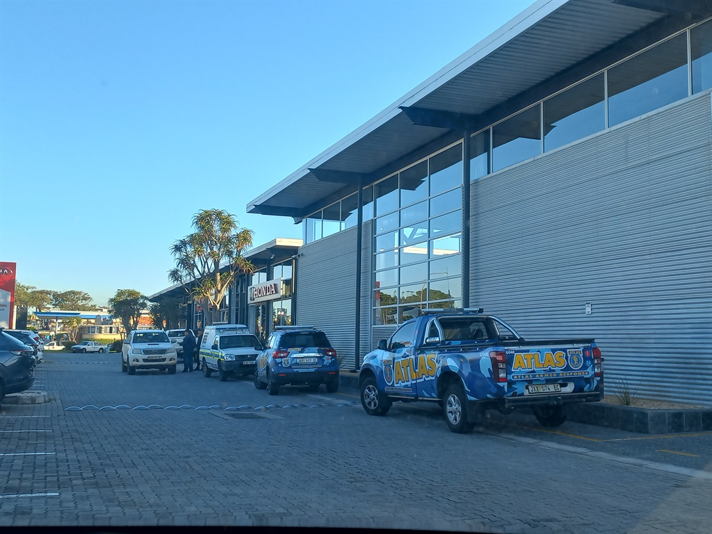 Man survives multiple gunshot wounds during shooting at car dealership