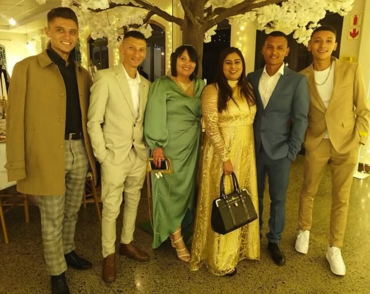 Nadia Kassim (in gold dress), a single mother of five boys, received her MBA during the graduation ceremonies.