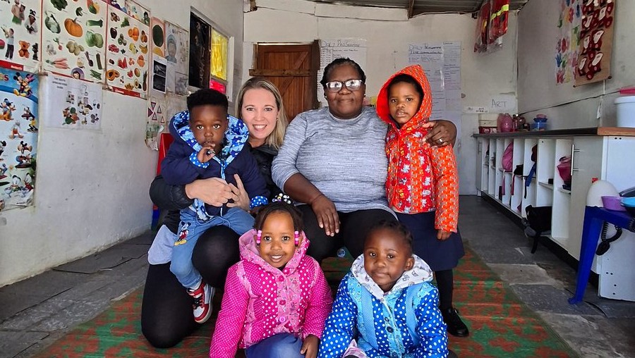 The Community Chest's Winter Woolly Drive recently delivered much-needed warmth to children at Joe Slovo's Kamvalethu Day Care. Pictured are Colette Theron (Marketing Manager: Community Chest) and the principal of Kamvalethu Day Care, Nokuzola Mphalisa.