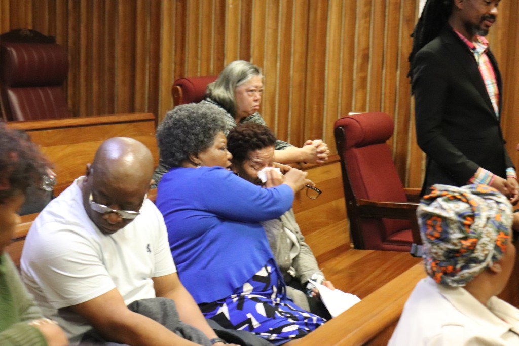 Nombuyiselo Mhlauli and Nomonde Calata consoling each other during Lukhanyo Calata's testimony.