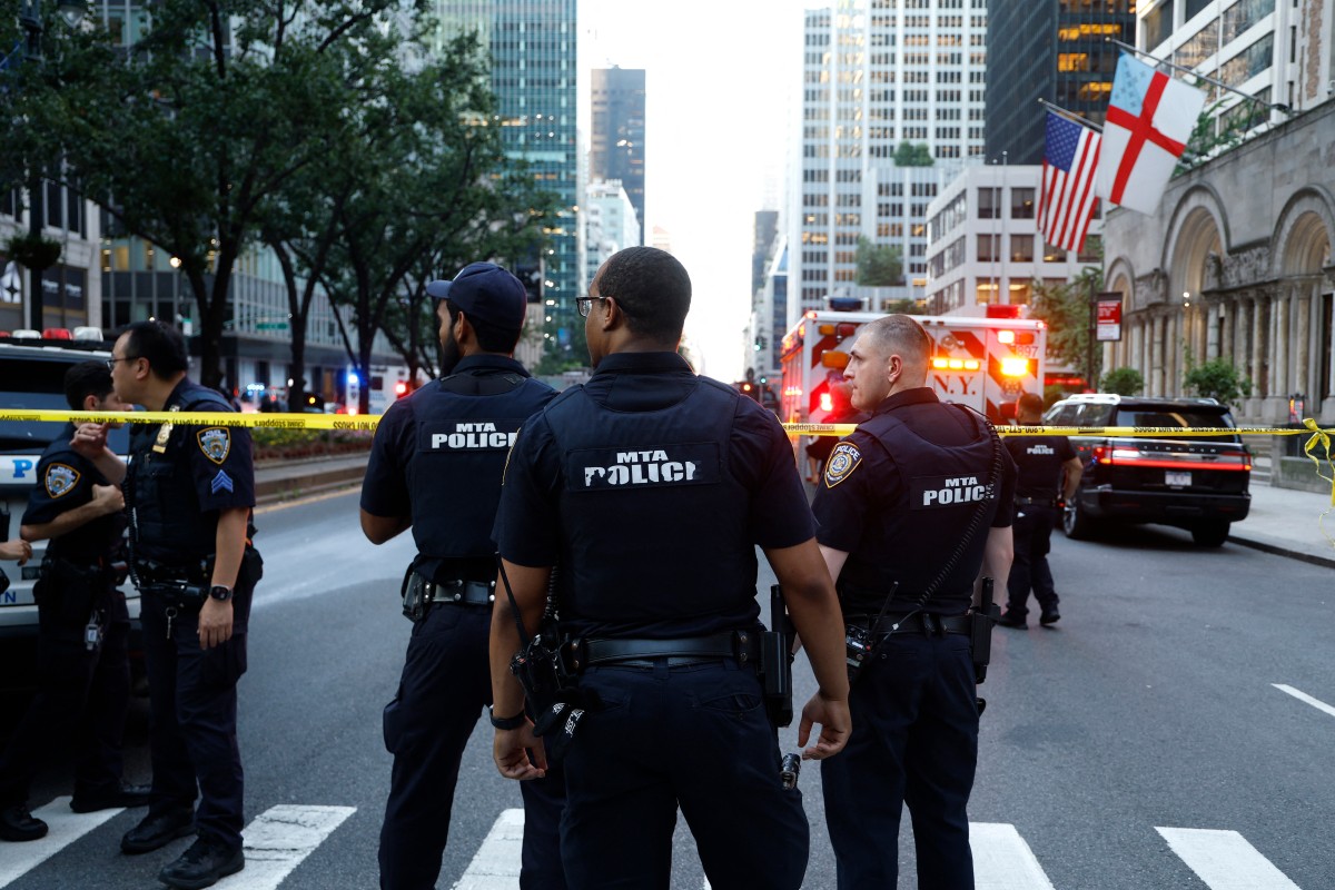 A gunman killed four people, including a police officer, during a shooting spree in central Manhattan. PHOTO: John Lamparski / AFP