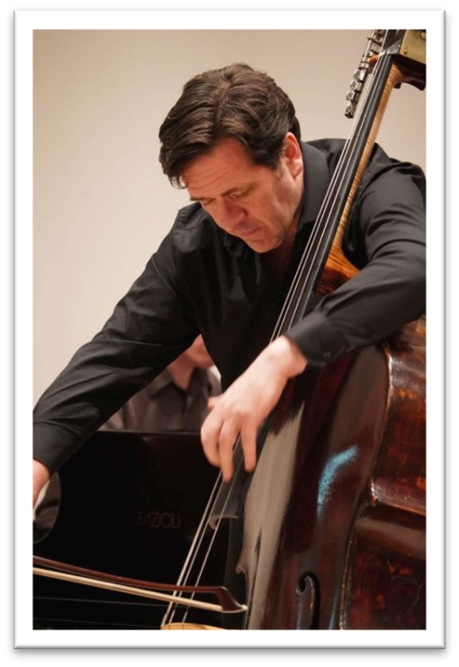 Tony Alcock with a musical instrument.