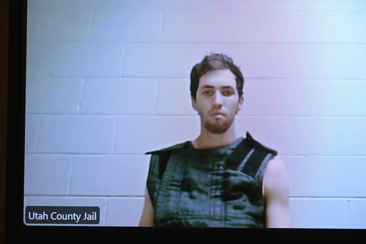 A screen shows Tyler Robinson, the suspect in the killing of political activist Charlie Kirk, as he attends a court appearance remotely from his jail cell. (Photo by AFP)