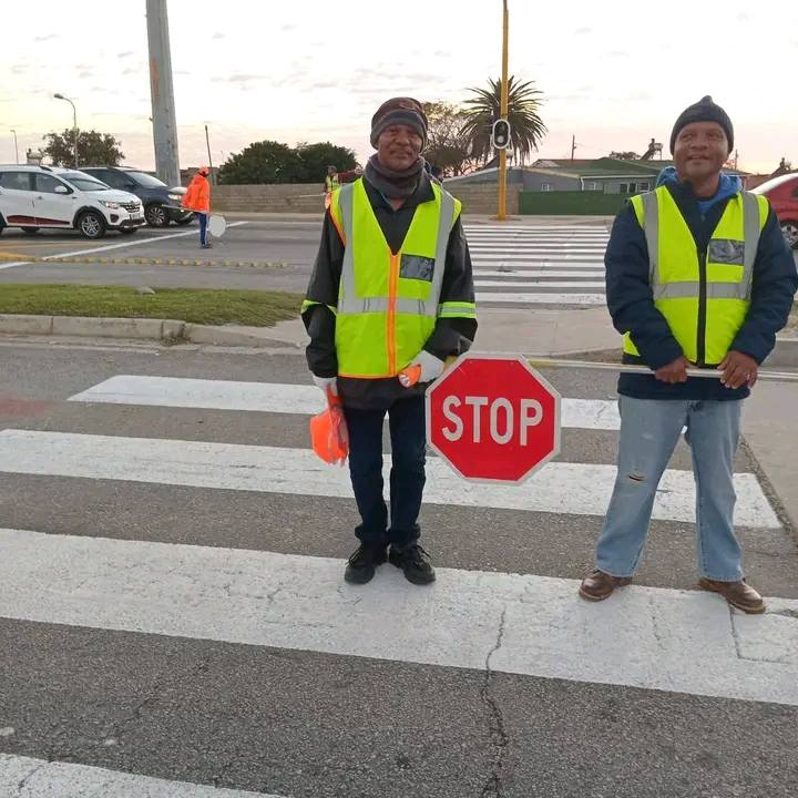 Volunteers work daily shifts from 06:30 to 08:30 each morning, helping school children cross the busy Stanford Road.