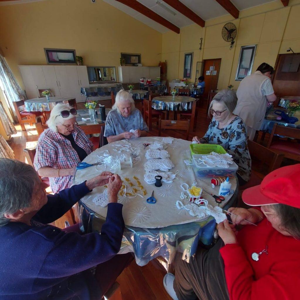The craft group at Buffelsfontein Village consists of 20 people aged from 60 to 84.