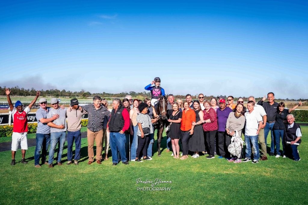 Family and friends celebrate Kyle Strydom's memorable victory.