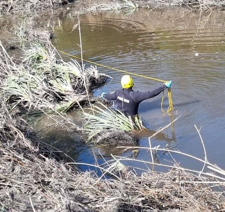 Members of the Search and Rescue Unit recovered the body of a man that was swept away in floodwaters.