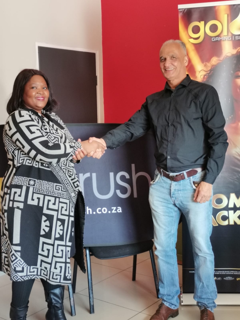 Women shaking hands with a man