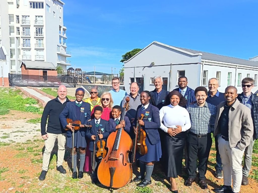 The music department staff, learners, principal and deputy principal and Thembela Architects, Johnston and Williams QS, Dekon Projects on the Music Department Site.