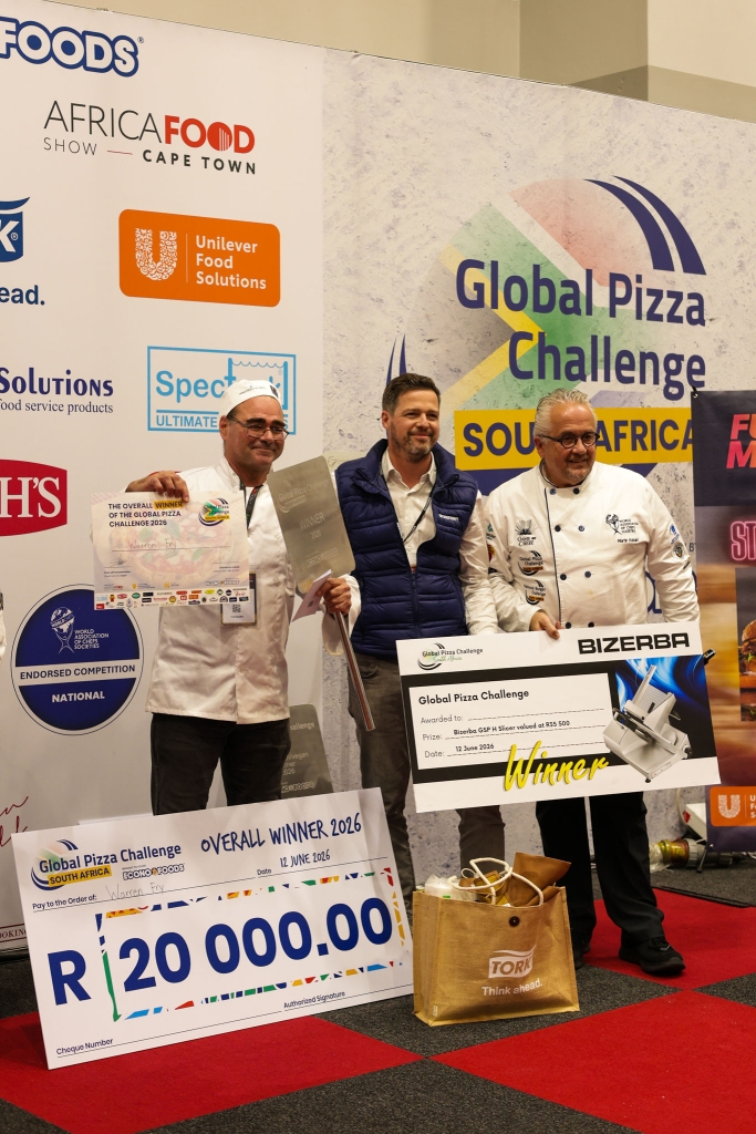 3 men holding a cheque for the Global Pizza Challenge