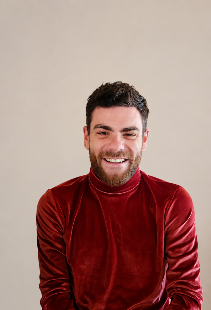 Man posing in front of a camera