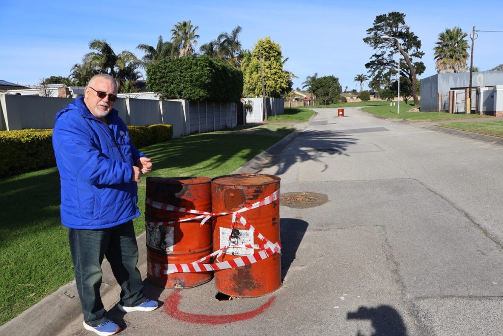 Ward 8 Councillor Gustav Rautenbach pointed out where large barrels have been placed above potholes in Arras Street, Lorraine.