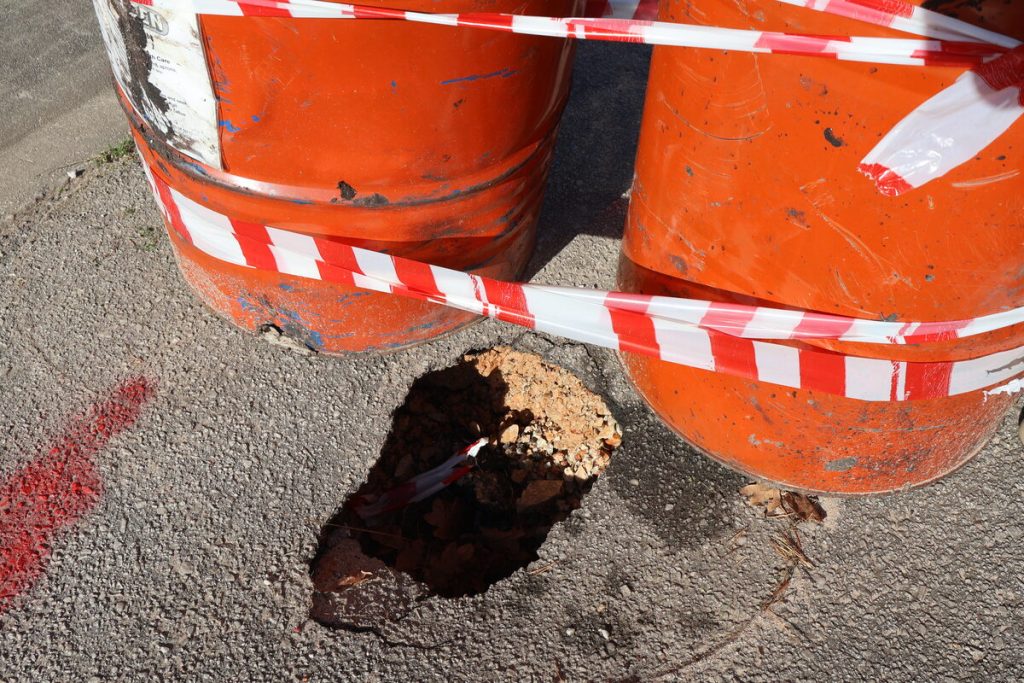 Potholes that are turning into sinkholes in Arras Street, Lorraine.