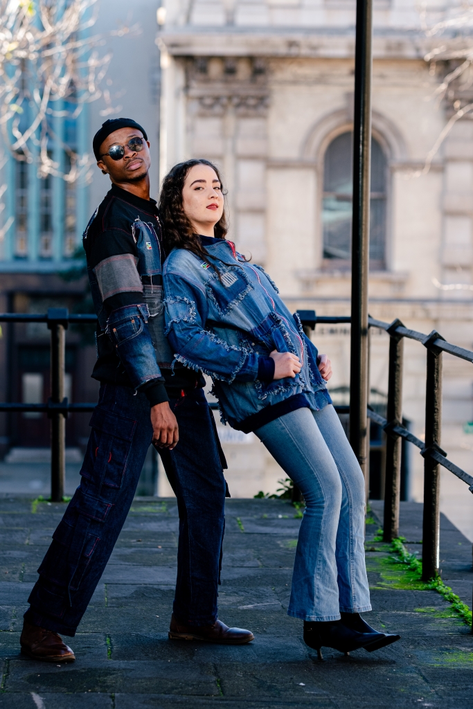 Man and women posing in front of the camera